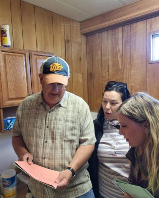 Health Team and Umatilla Staff looking at documents