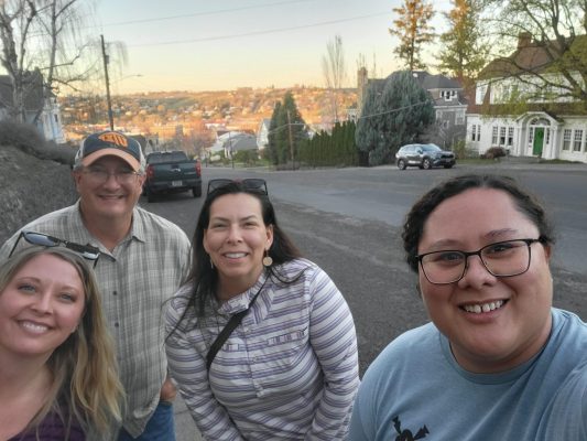 Health Team and Umatilla Staff photo overlooking a town